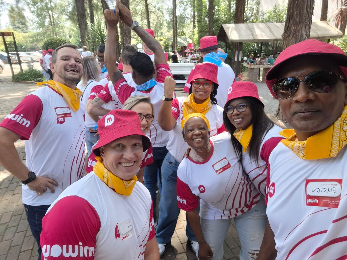 Corporate team celebrating together at an outdoor team building event