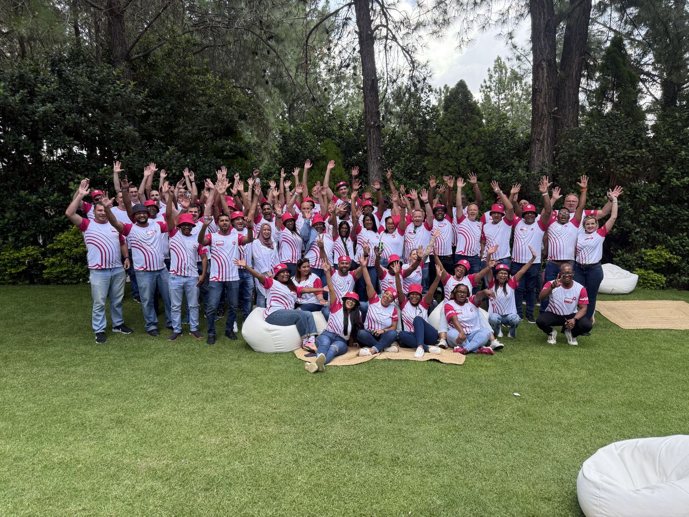 Large corporate group celebrating together outdoors