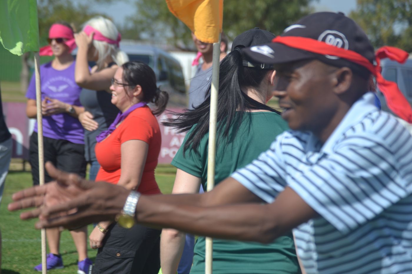 Colleagues cheering on their team during a challenge