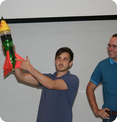 team showing small rocket