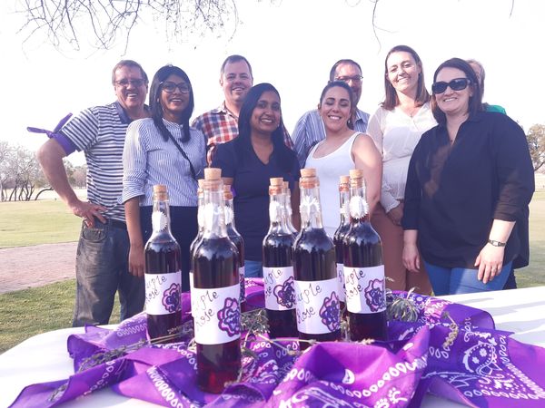Colleagues with the wine blends they created