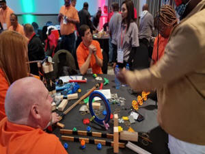 people building a chain reaction
